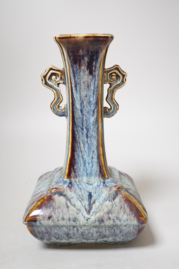 A Chinese Shiwan two handled vase, 23cms high